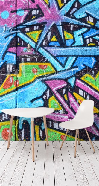 Picture of Fragment of graffiti drawings The old wall decorated with paint stains in the style of street art culture Colored background texture in cold tones